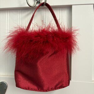 Unbranded deep red mini bag with feather trim and snap closure